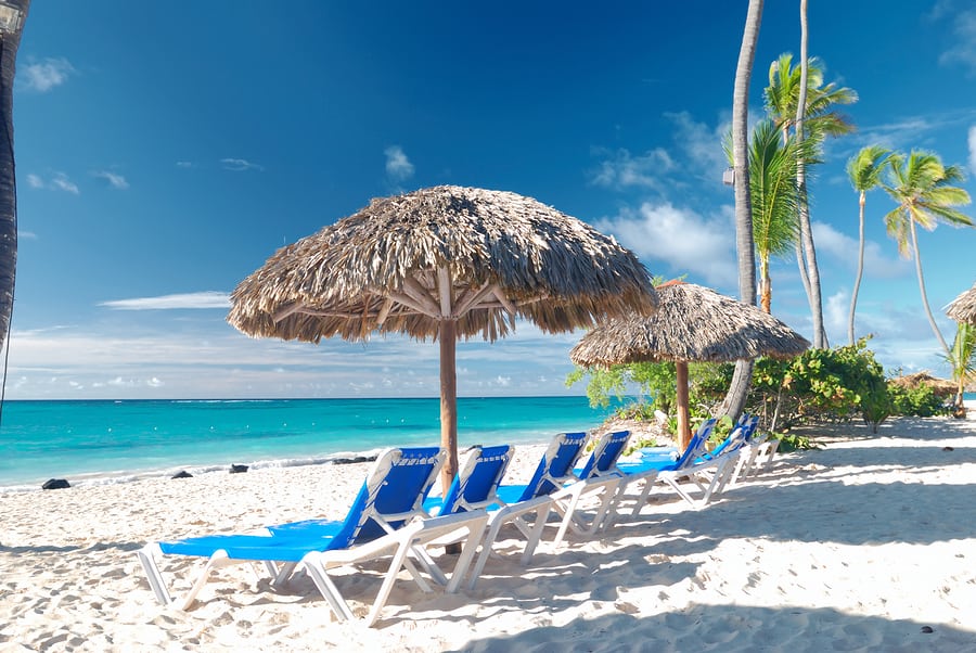 Beautiful caribbean beach with chaise lounge in Dominican Republ